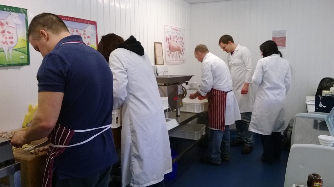 People preparing food in kitchen